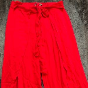 Never worn. Red flowy pants from Blue Blush.